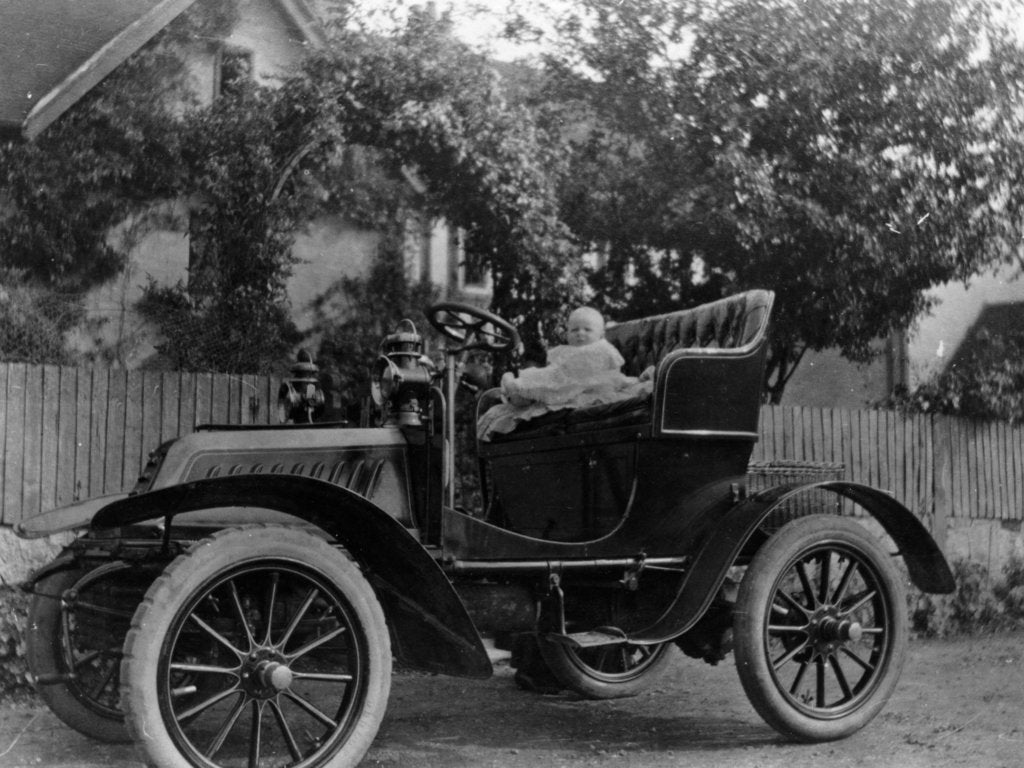 Detail of A baby on the seat of a De Dion Bouton car, 1903 by Unknown