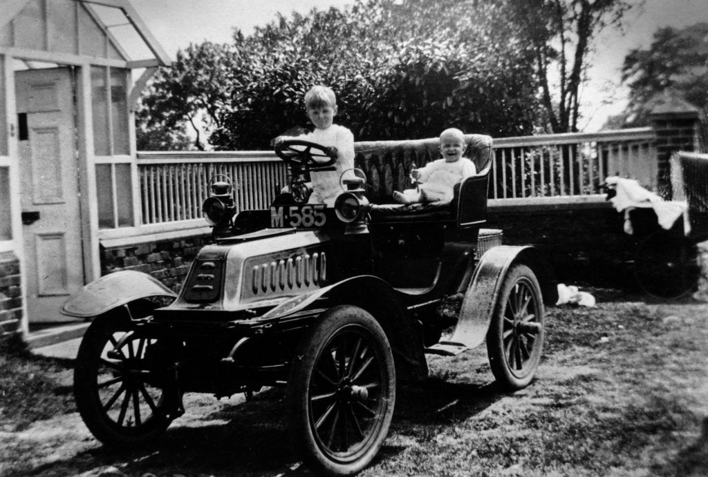 Detail of A child at the wheel of a De Dion Bouton car, 1903 by Unknown