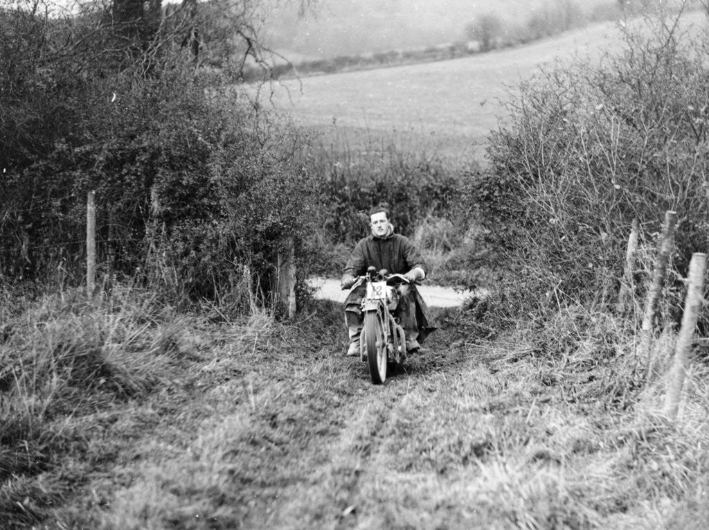 Detail of Syke riding an Ariel 4 during the Inter Varsity motor cross hill climb by Anonymous
