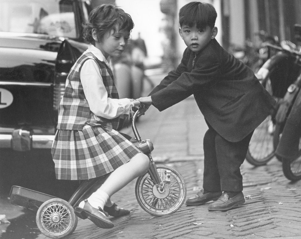 Detail of Children playing with a tricycle, c1960s by Tony Boxall