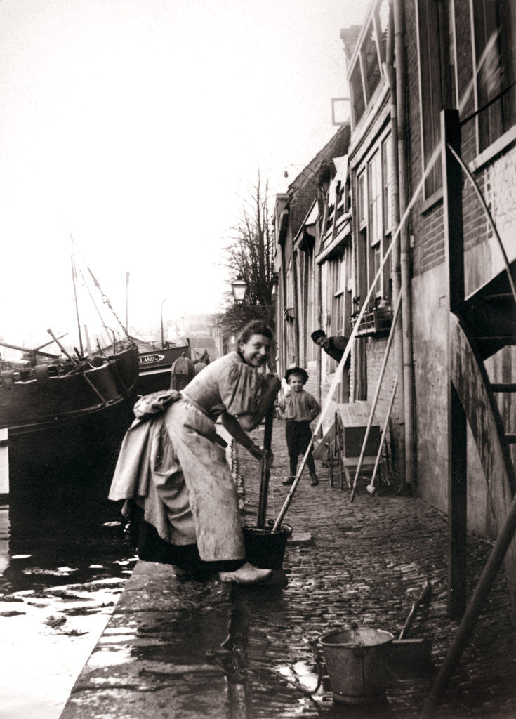 Detail of Woman mopping the street, Dordrecht, Netherlands by James Batkin