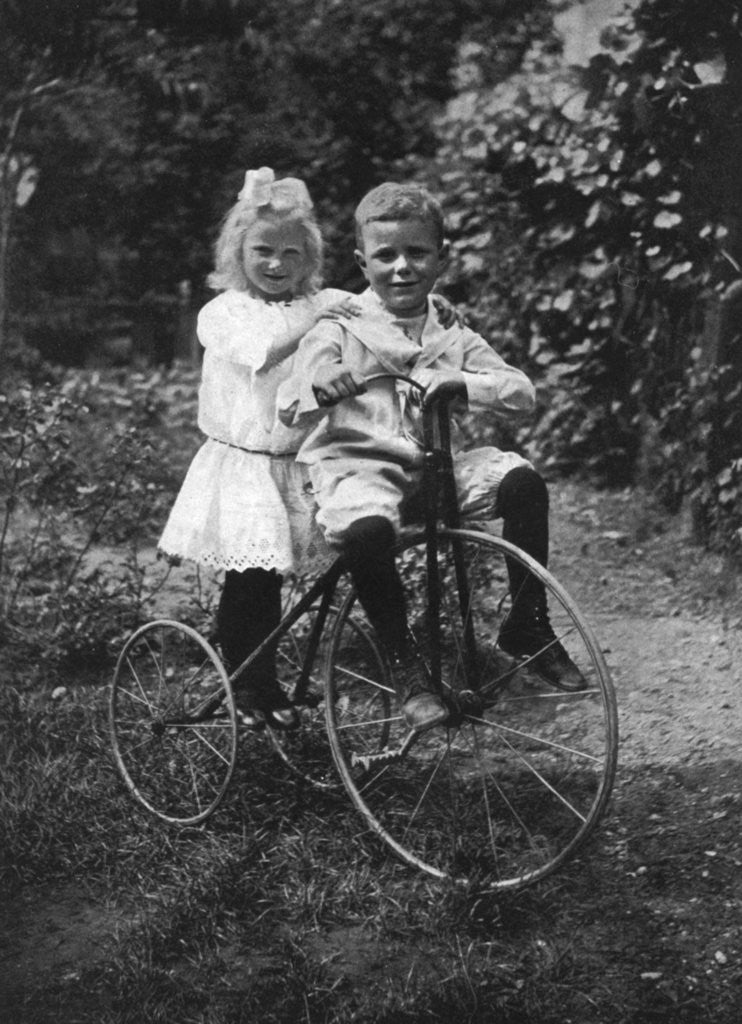 Detail of Two children on a tricycle by CW Perry