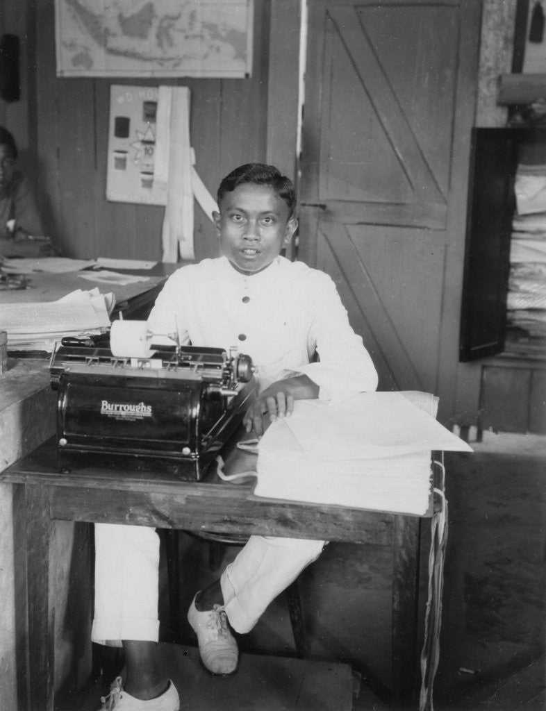 Detail of A young man sitting at a typewriter, Indonesia by Anonymous