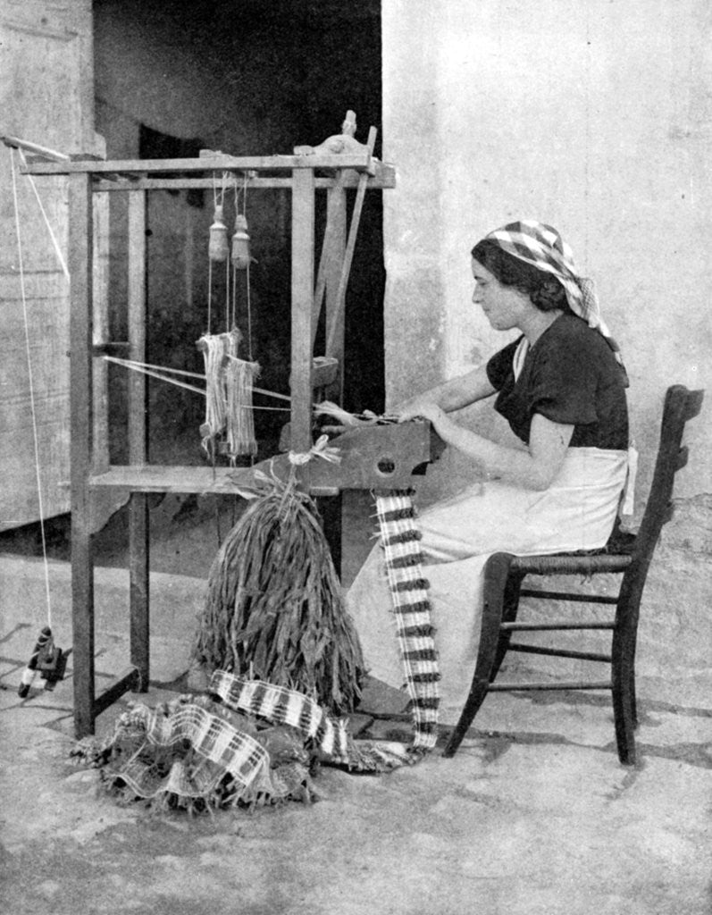 Detail of Woman weaving with straw on a hand loom, Fiesole, near Florence, Italy by Donald McLeish