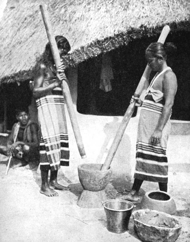 Detail of Newar women pounding grain, Nepal by Ewing Galloway