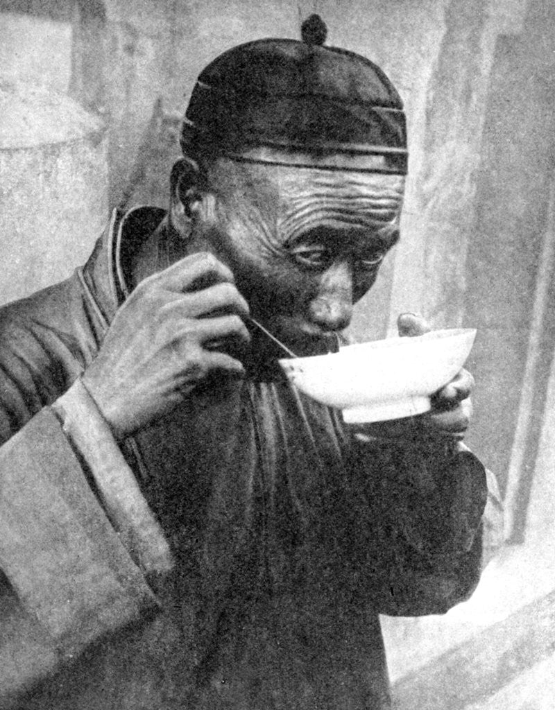 Detail of A man eating, Mukden (Shenyang), China by Wide World Photos