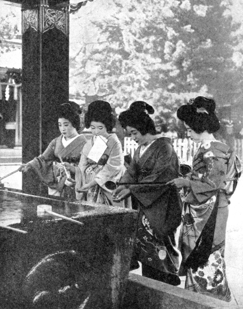 Detail of Japanese women washing their hands prior to entering a temple by Sport & General