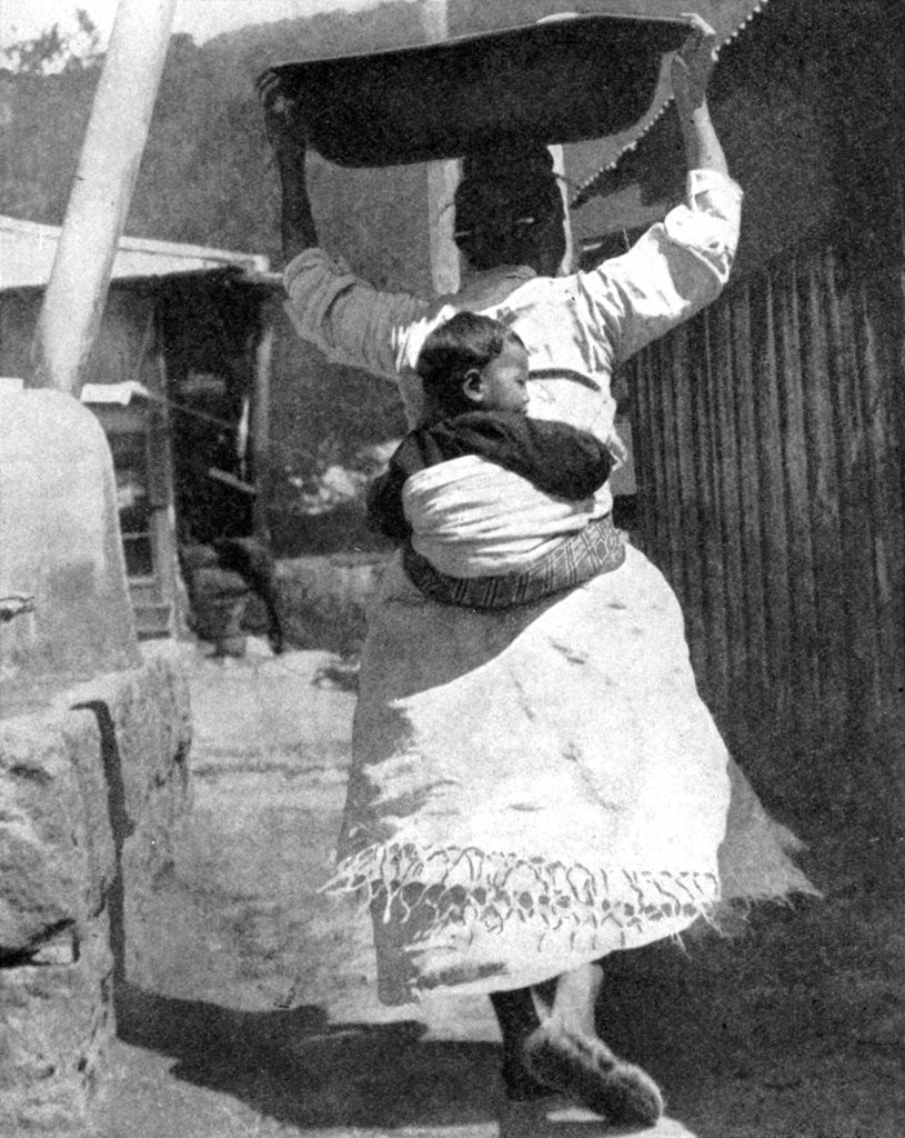 Detail of A Korean woman carrying a baby on her back by Wide World Photos