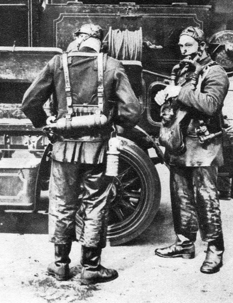 Detail of Firefighters donning smoke helmets, Farringdon Street rubber works, London by Anonymous