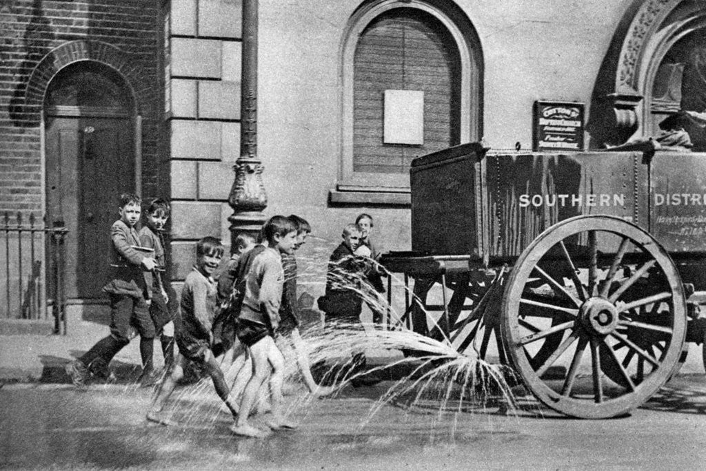 Detail of Boys following the Poplar Borough Council water cart, London by Anonymous
