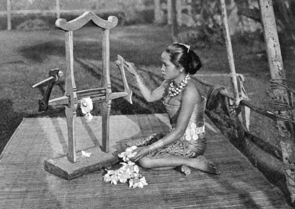 Detail of Iban woman making thread with a mangle, Borneo by Dr Charles Hose