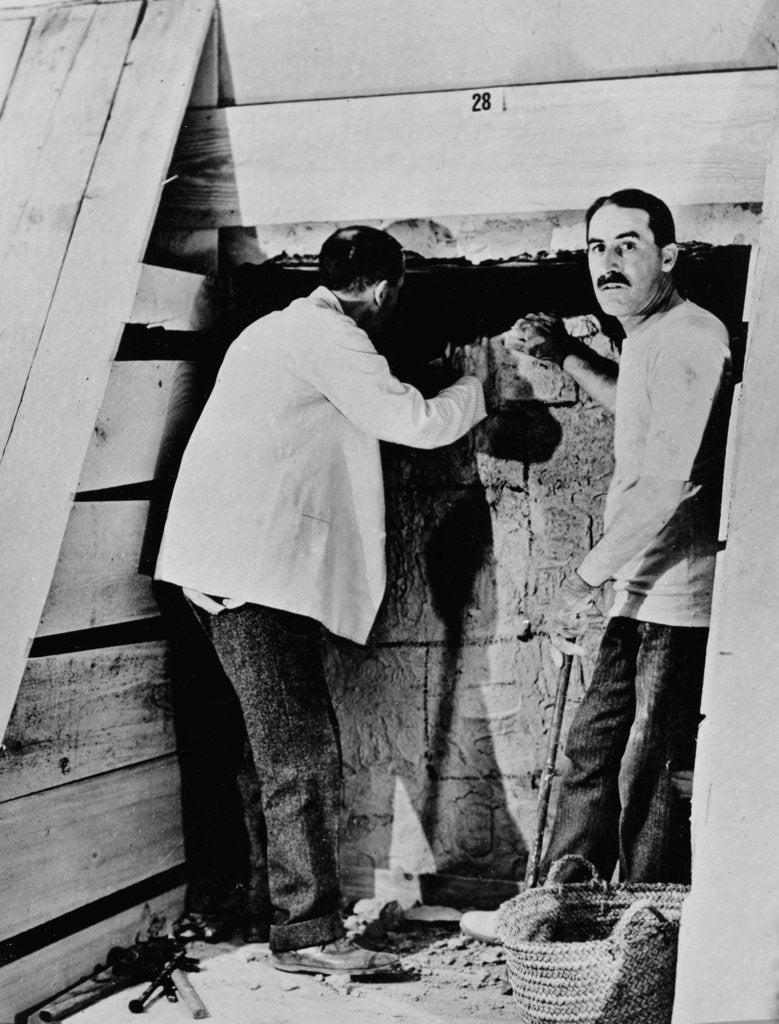 Detail of Howard Carter and a colleague excavating a tomb in the Valley of the Kings by Harry Burton