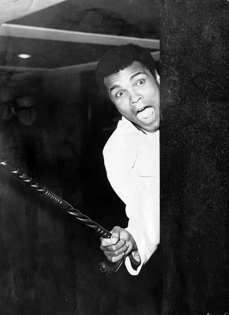 Detail of Muhammad Ali larking about at Heathrow by Associated Newspapers