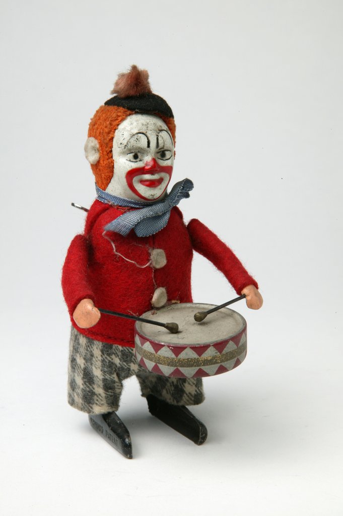 Detail of Clockwork toy clown with a drum by Schuco