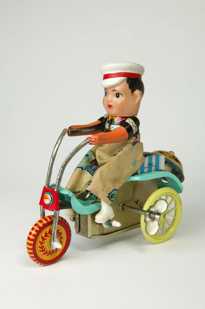 Detail of Clockwork toy boy on a tricycle by Unknown