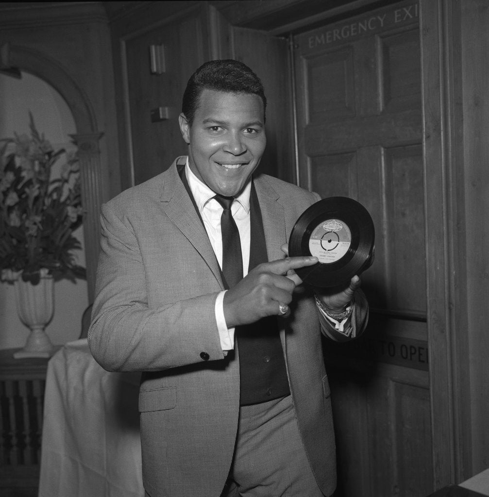 Detail of Chubby Checker holding a record by Harry Hammond