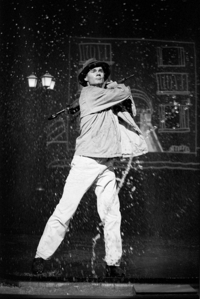 Detail of Paul Robinson in Betty Comden and Adolph Green's SinginÆ in the Rain at the National Theatre by Graham Brandon