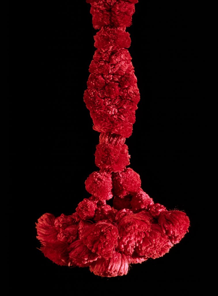 Detail of Red tassle of a cap by Unknown