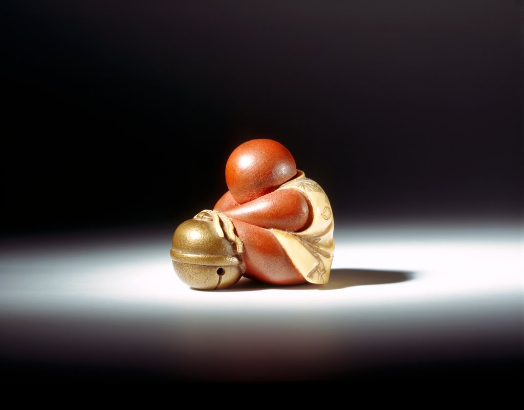 Detail of Netsuke abstract doll leaning over a bell by Unknown