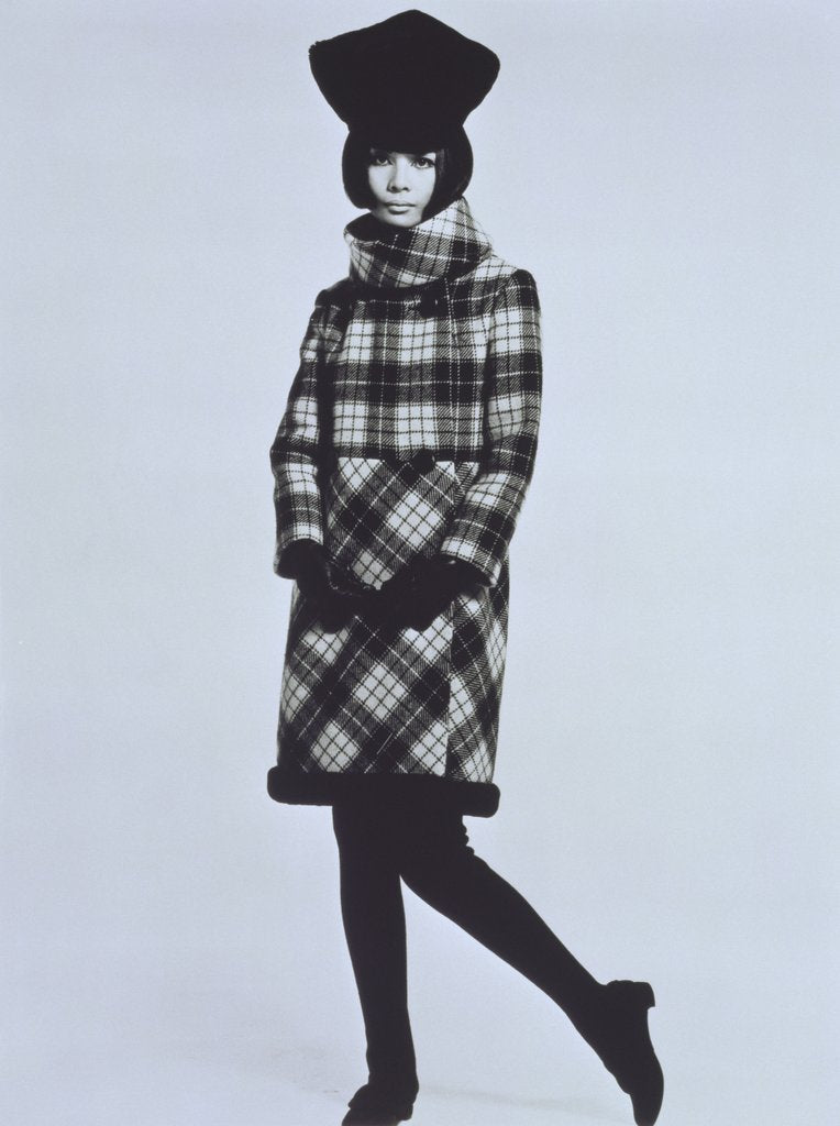Detail of Hiroko in a Pierre Cardin coat and hat by John French