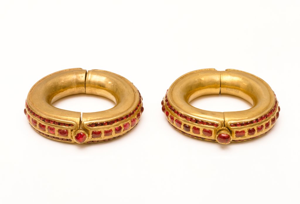 Detail of Pair of bangles set with rubies by Unknown