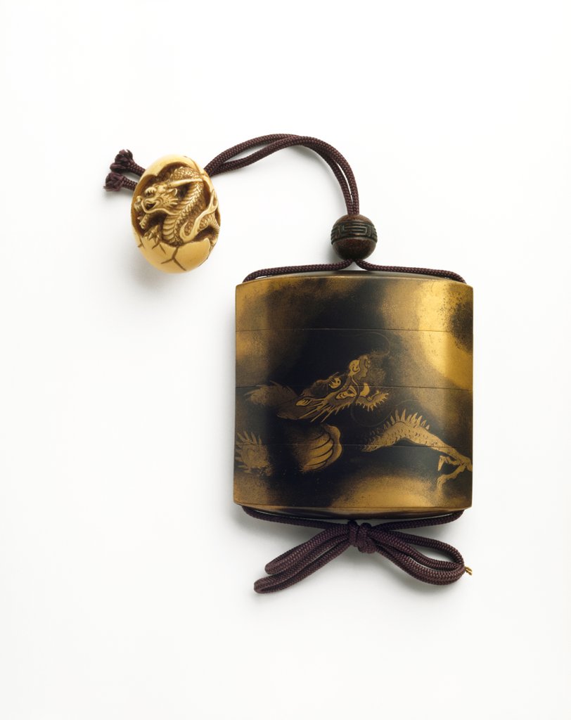 Detail of Inro depicting dragon and egg tassel by Yamada Joka