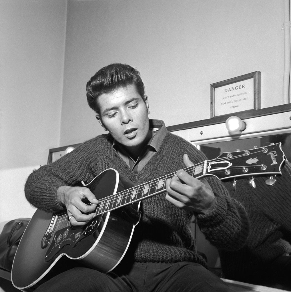 Detail of Cliff Richard playing his guitar by Harry Hammond