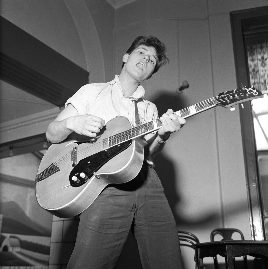 Detail of Cliff Richard playing the guitar by Harry Hammond