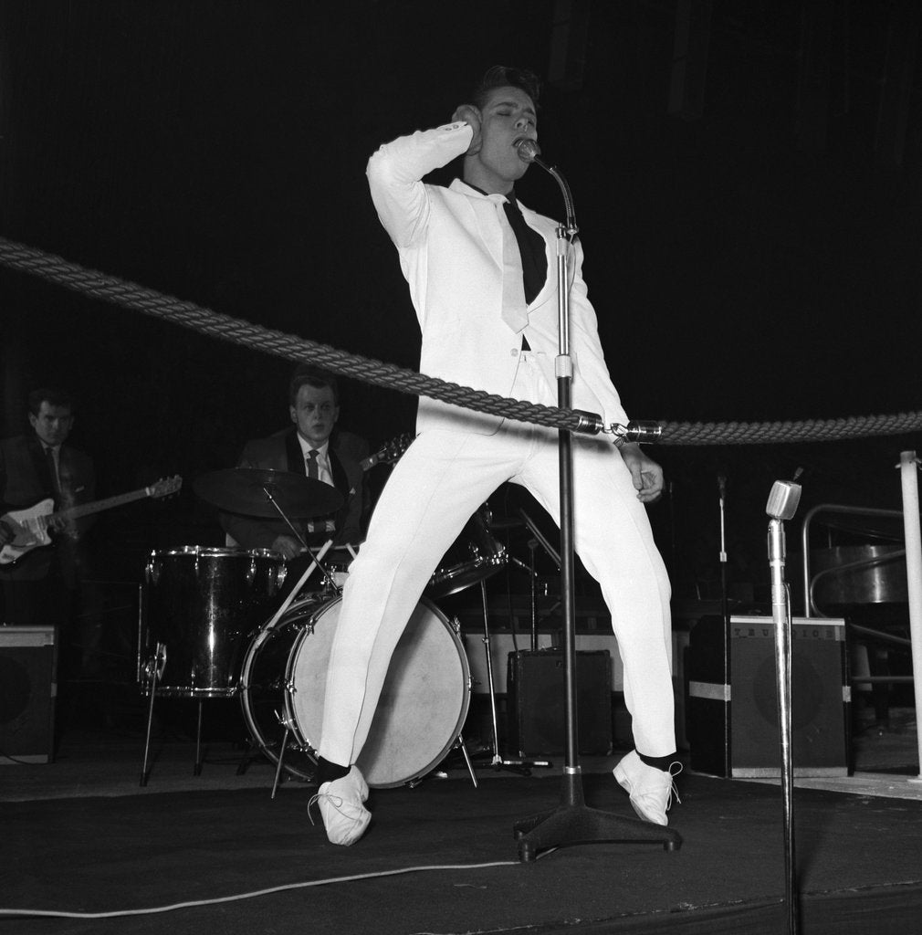 Detail of Cliff Richard performing on stage by Harry Hammond