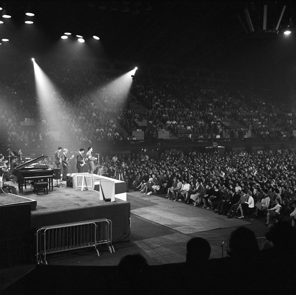 Detail of Cliff Richard and the Shadows performing on stage by Harry Hammond
