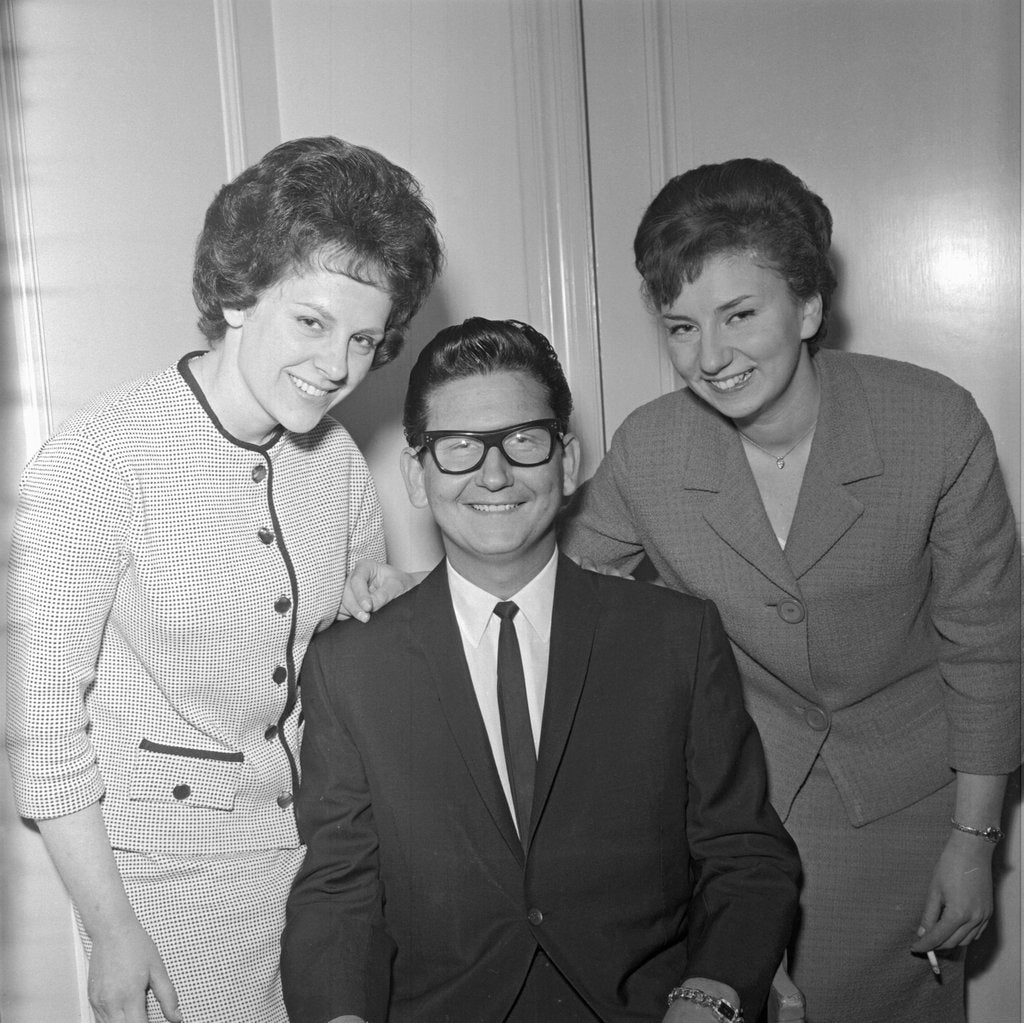 Detail of Roy Orbison posing with two fans by Harry Hammond