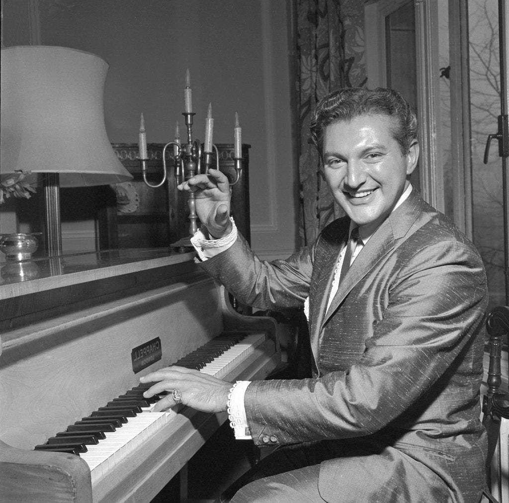 Detail of Liberace playing the piano at the Savoy Hotel by Harry Hammond