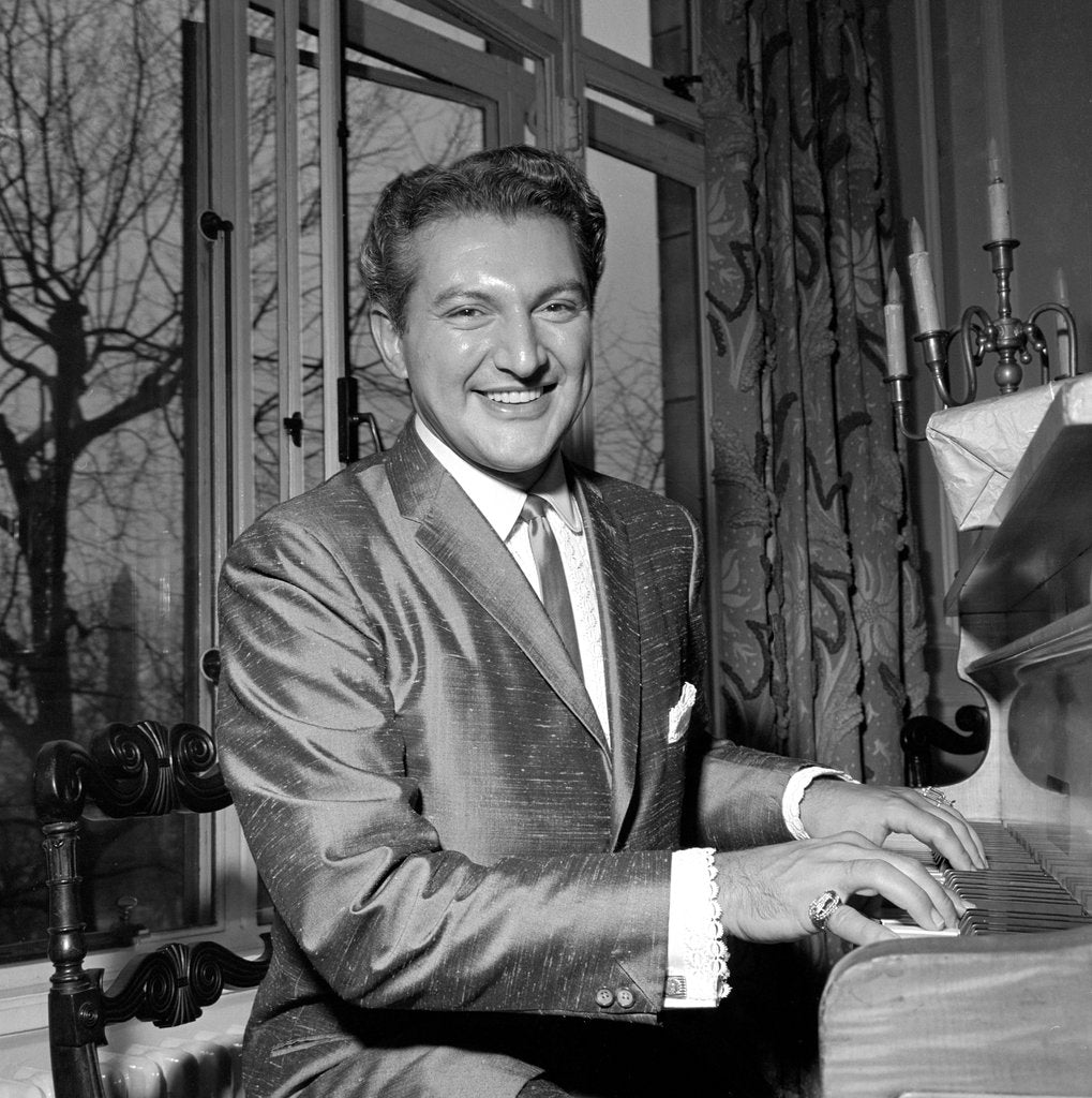 Detail of Liberace playing the piano at the Savoy Hotel by Harry Hammond