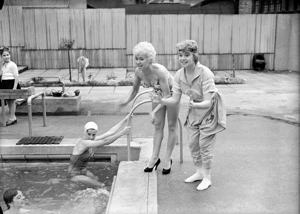 Detail of Shani Wallis with Vera Day in a swimming pool by Harry Hammond