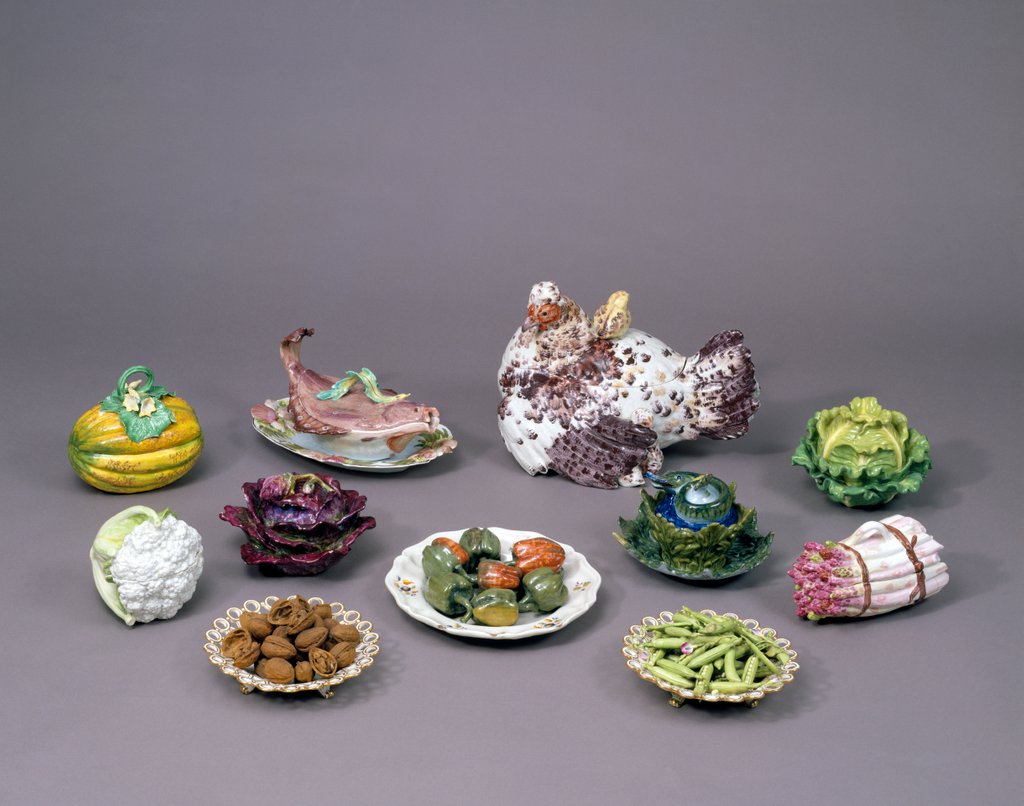 Detail of Arrangement of ceramic tureens and trick plates in the shape of vegetables and other food by Unknown