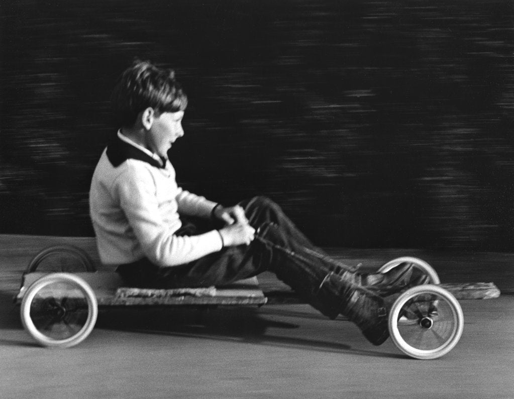 Detail of Boy driving a home-made go-kart, Horley, Surrey, 1965 by Tony Boxall