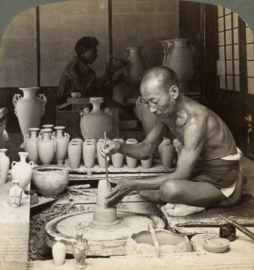 Detail of A potter and his wheel, fashioning a vase of Awata porcelain, Kinkosan works, Kyoto, Japan by Underwood & Underwood