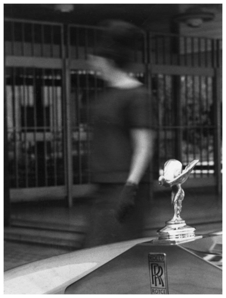 Detail of Woman walking past a Rolls-Royce by Anonymous