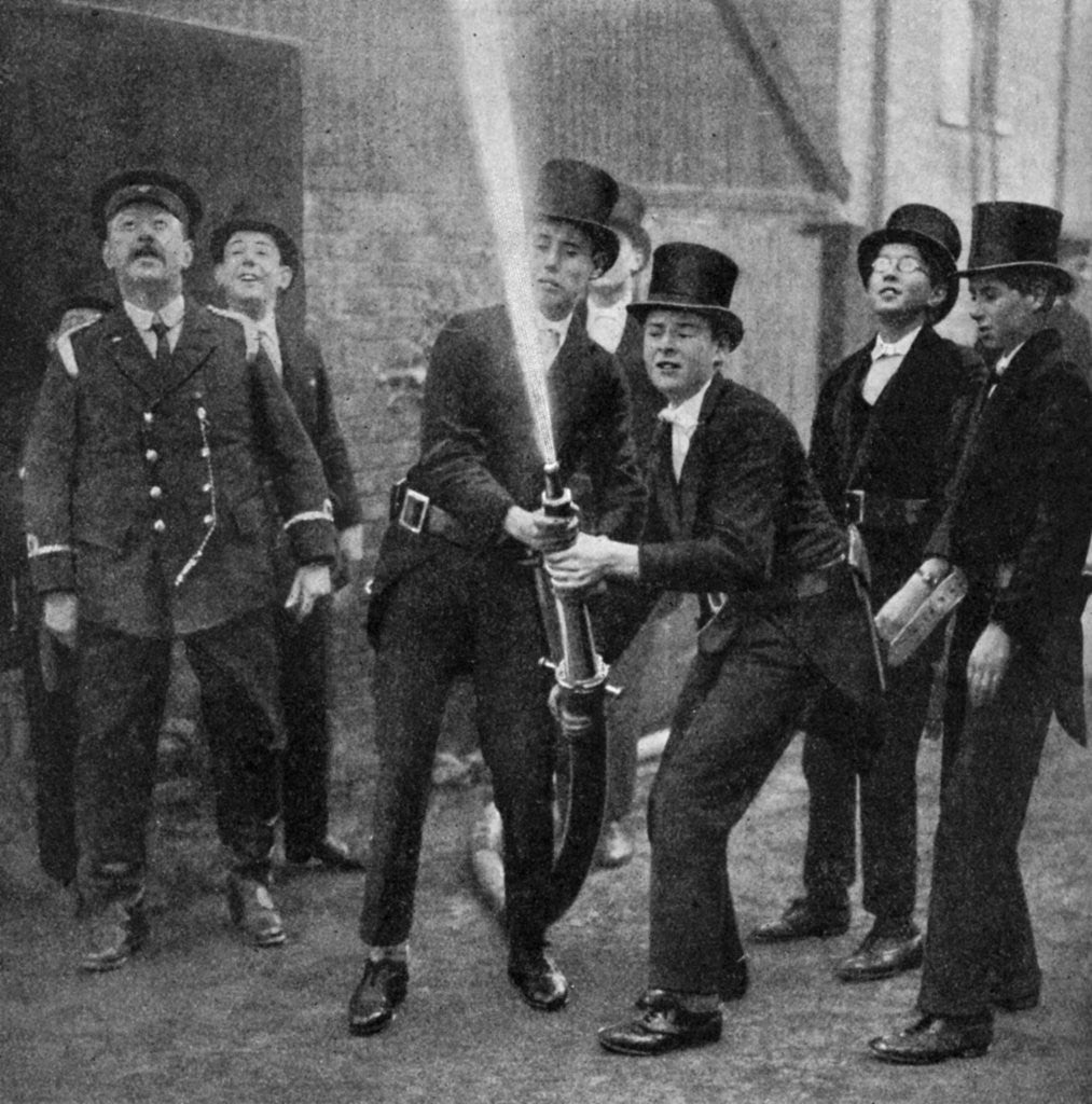 Detail of Eton's amateur firemen practising a hose drill, Berkshire by Anonymous