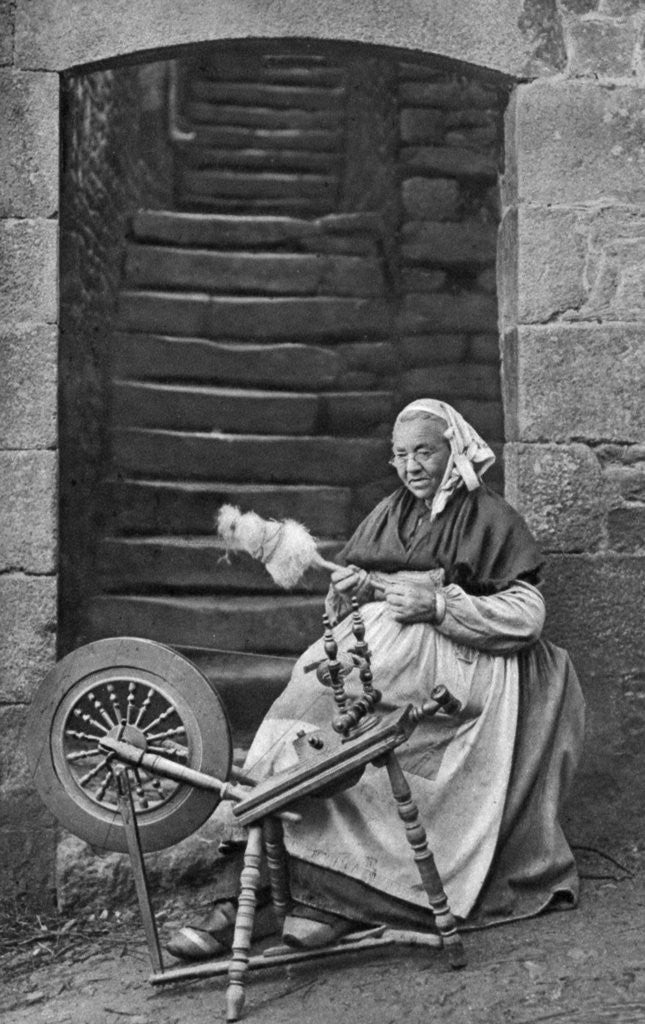 Detail of A woman at a spinning wheel, Dinan, Brittany, France by Anonymous