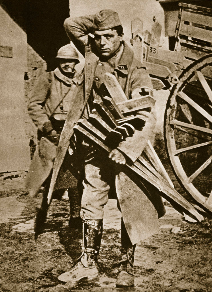 Detail of French soldier with wooden crosses to be placed on temporary graves by Anonymous