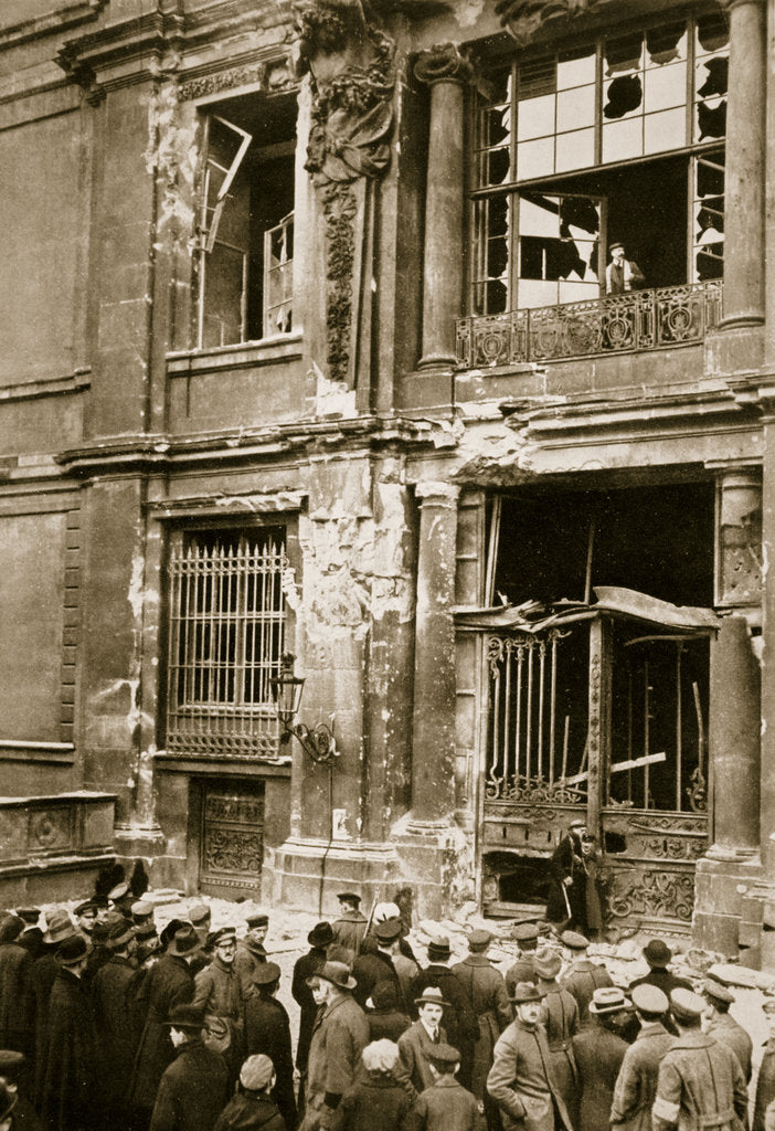 Detail of A crowd of men gathered in front of a ruined building, Germany by Unknown