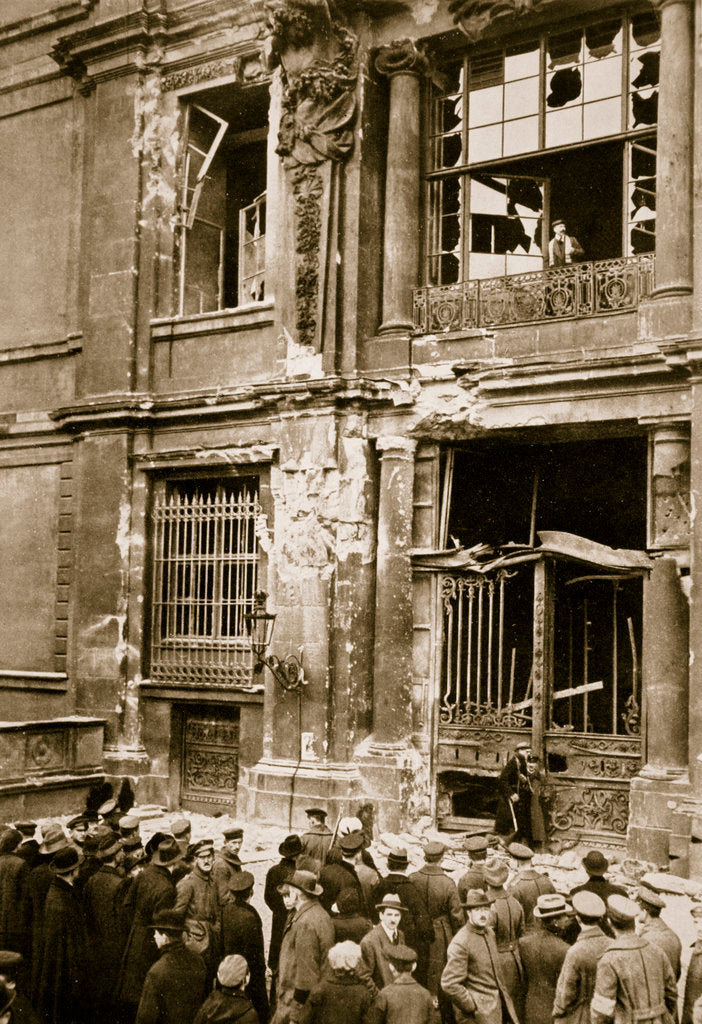 Detail of A crowd of men gathered in front of a ruined building by Anonymous