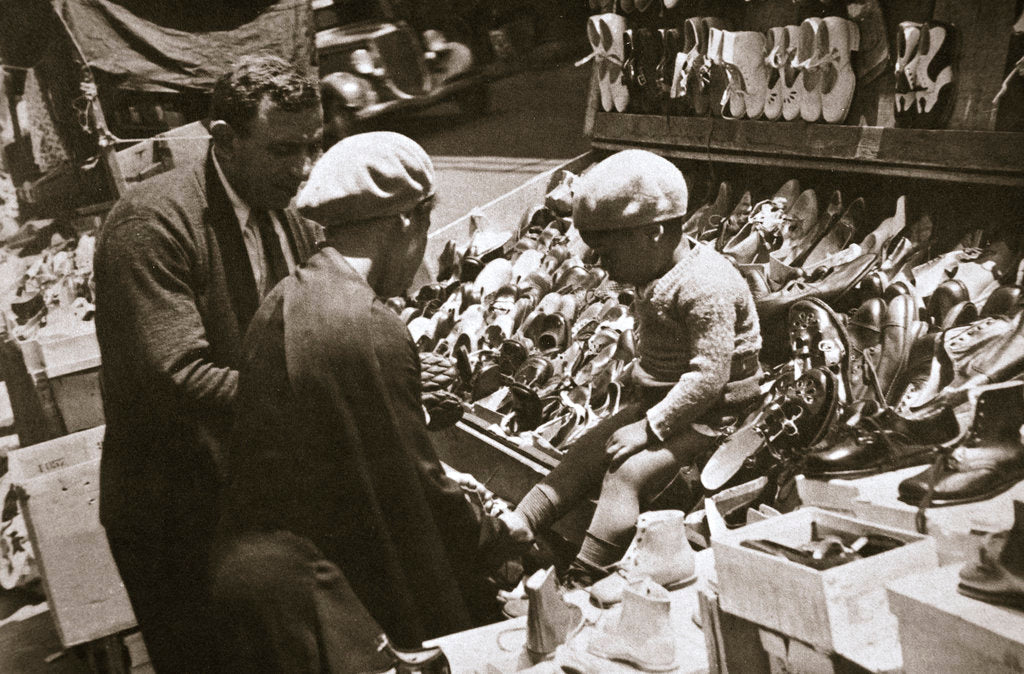 Detail of A woman from Harlem buys a pair of shoes for her child by Anonymous