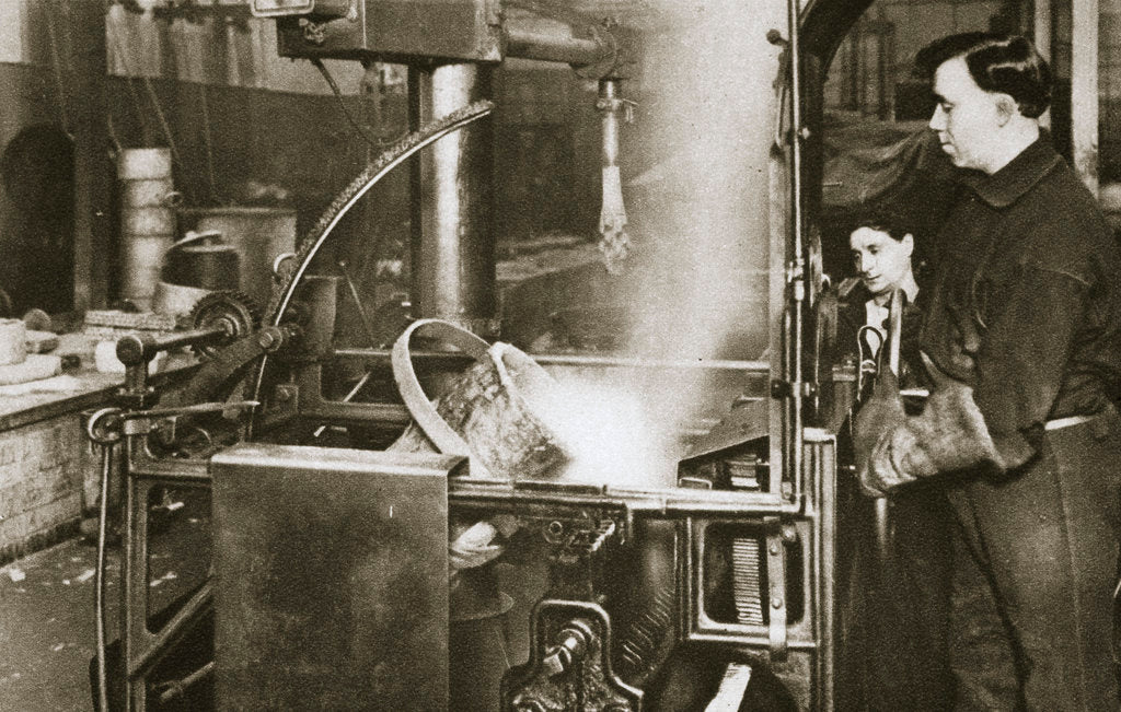 Detail of Making money; lowering a pot of liquid metal into a machine by Anonymous
