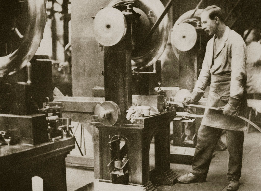 Detail of Money making; cutting strips of silver into disks by Anonymous