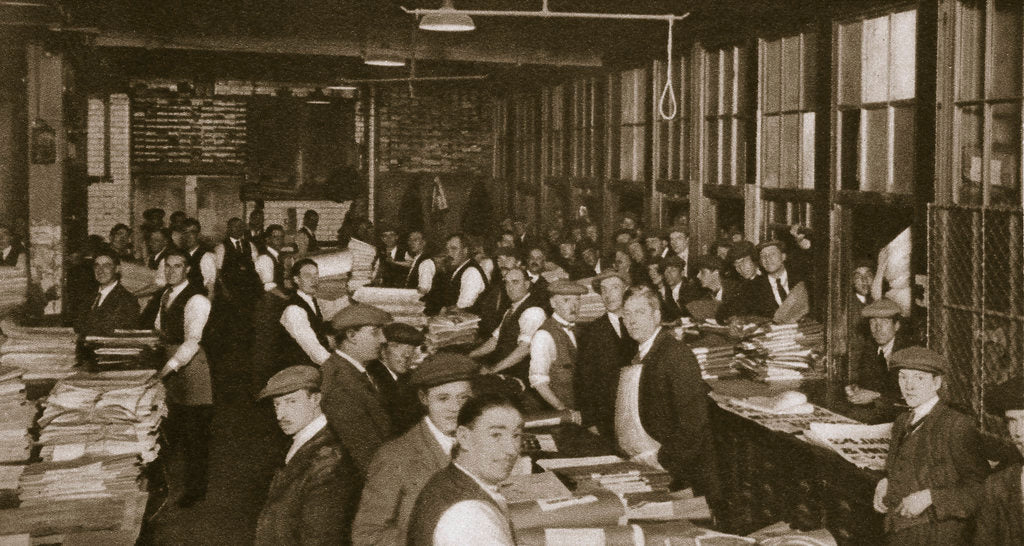 Detail of Newsvendors gather to pick up the next day's newspapers to sell by Anonymous