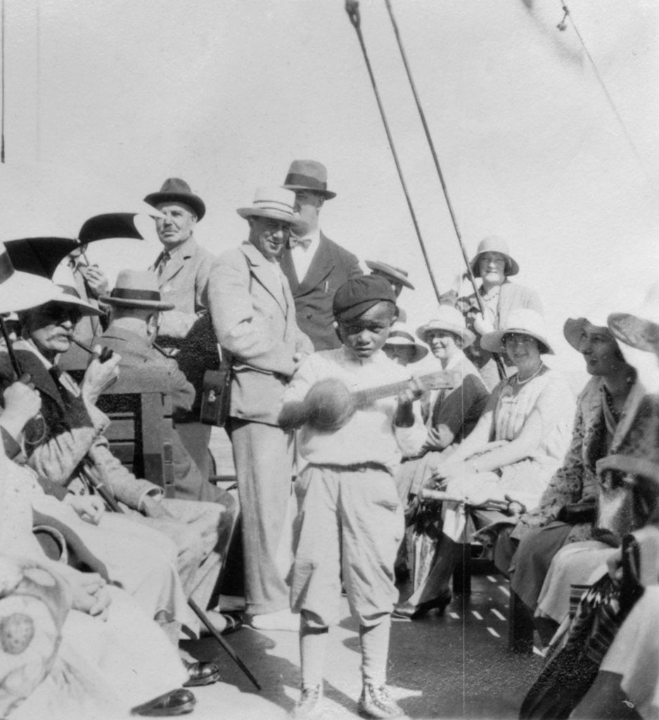 Detail of Tourists wathcing a boy playing a ukelele, Havana, Cuba by Anonymous