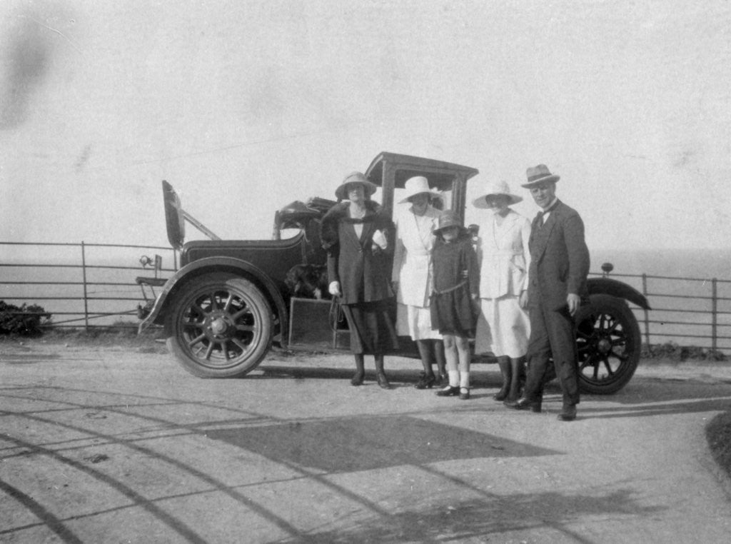 Detail of A group of people in front of their car at the seaside by Anonymous