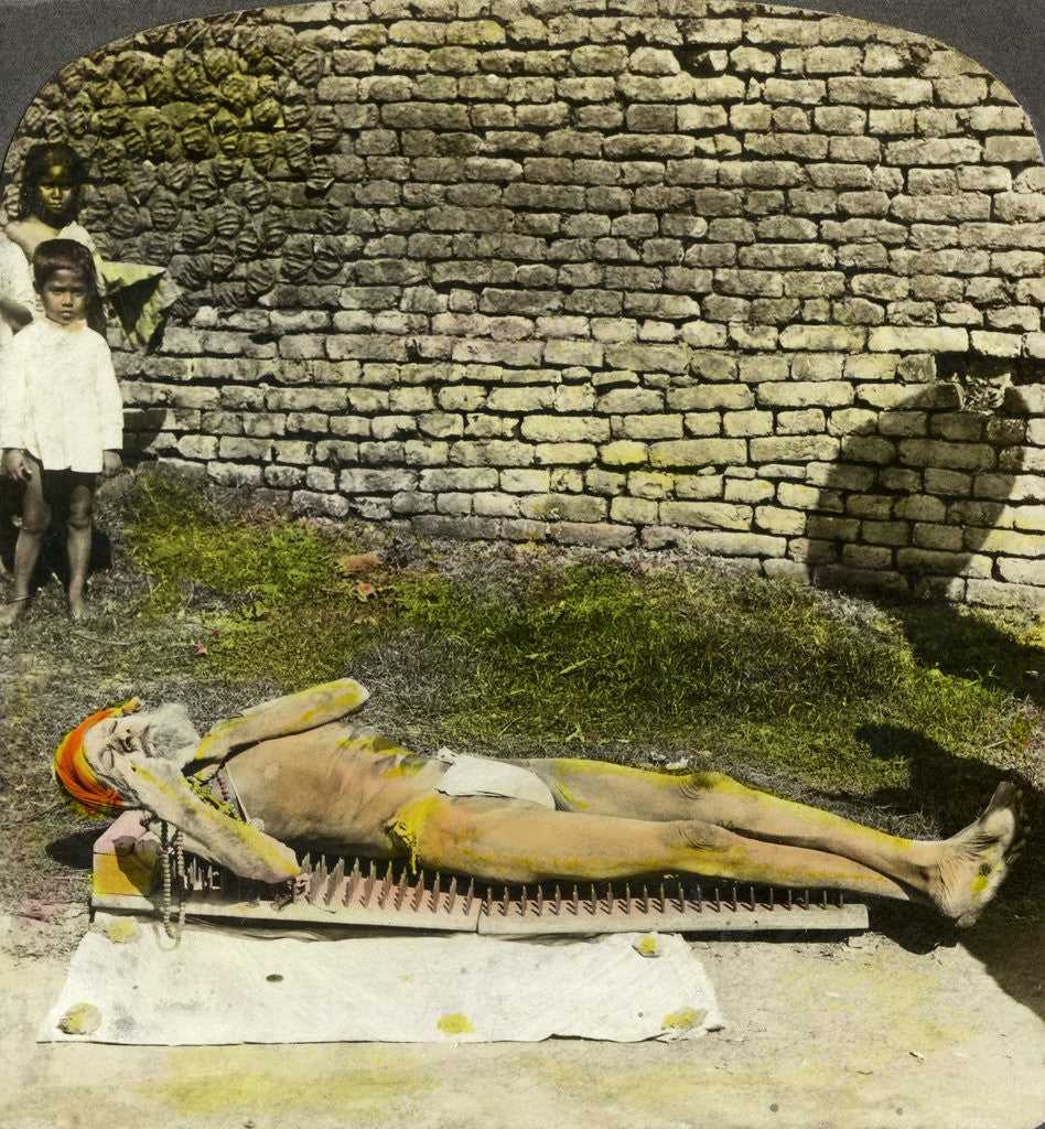 Detail of Hindu devotee on a bed of nails near the shrine of Kali, Calcutta, India by Underwood & Underwood